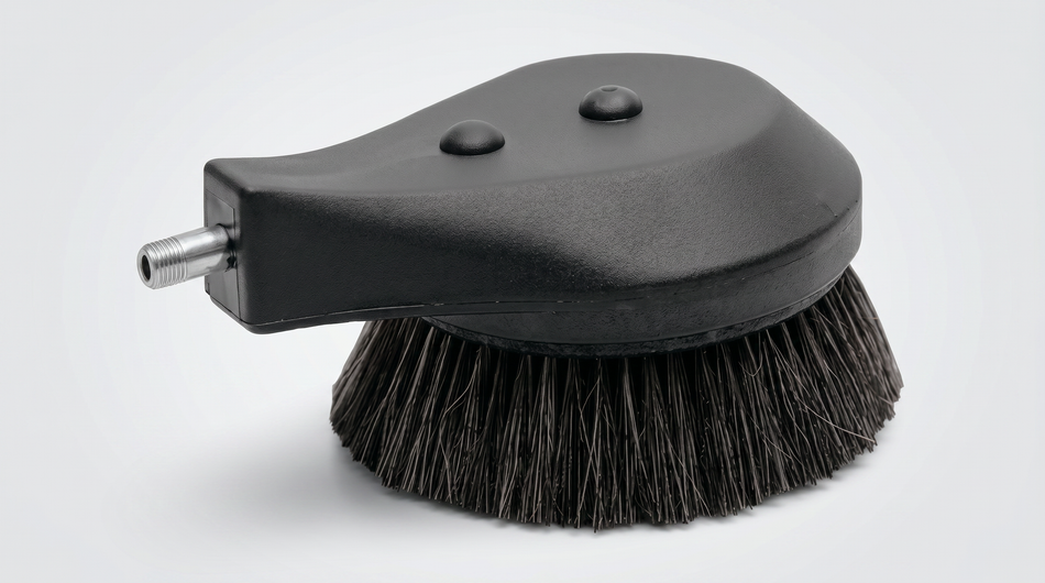Round black pressure-washer brush attachment with dense bristles and threaded inlet connection.