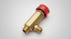 Brass thermal relief valve with red protective cap and dual threaded connections.