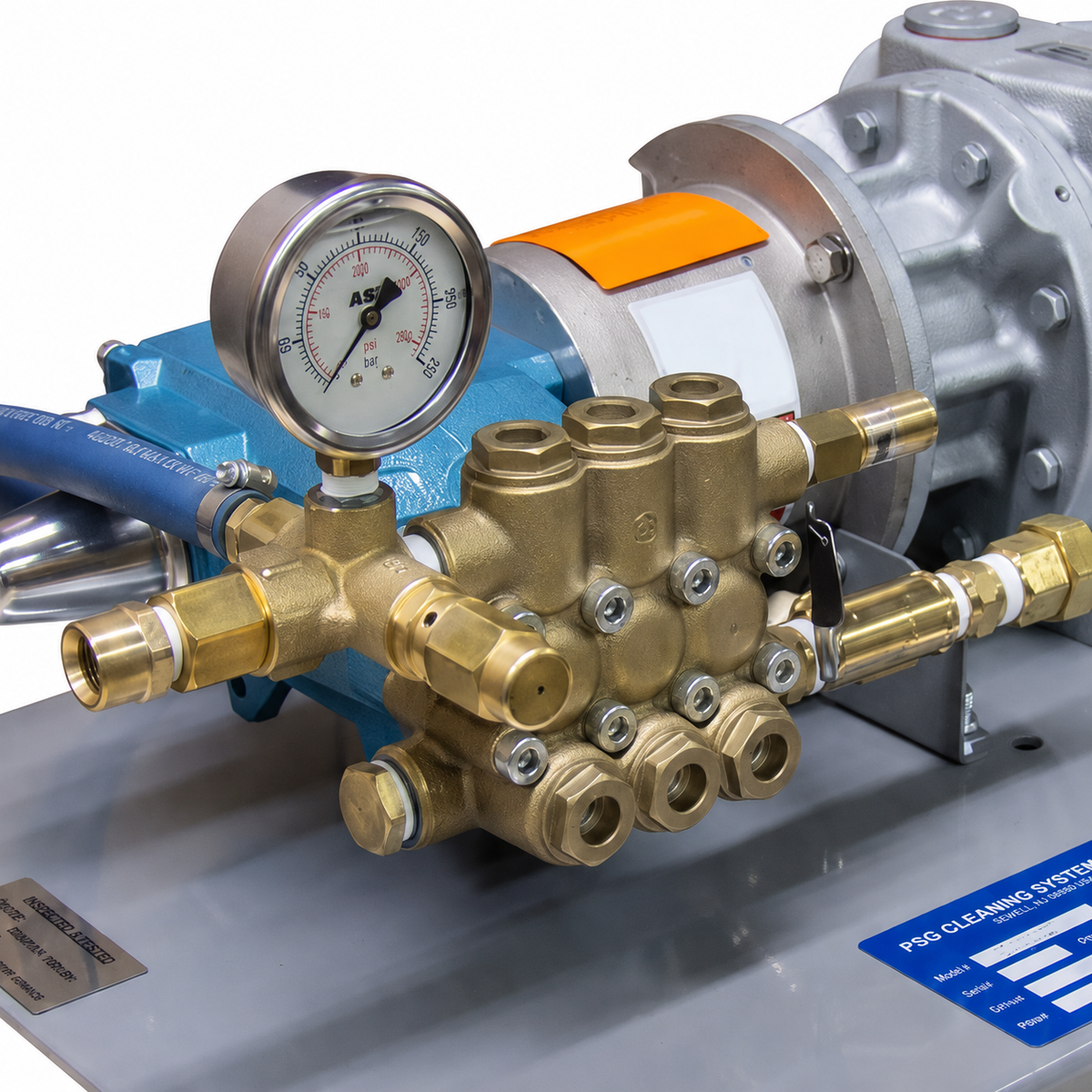 Close-up view of the CAT industrial triplex pump head with a brass manifold and liquid-filled pressure gauge on the 2000 PSI Air Pressure Washer.