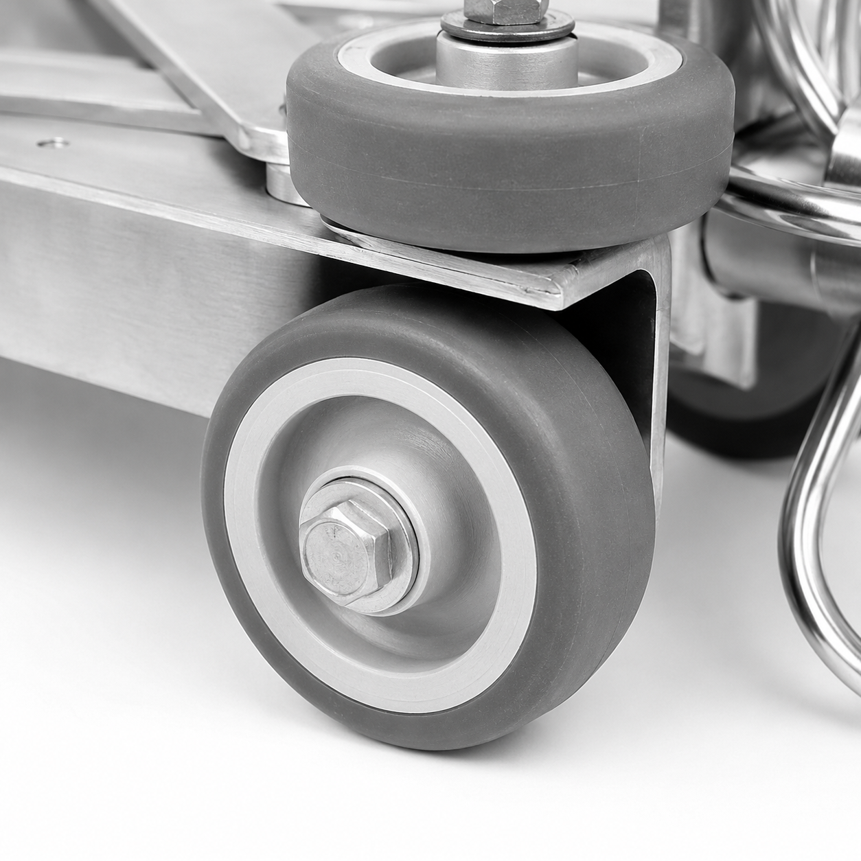 Close-up of the front wheel with mounted on the duct cleaning trolley.