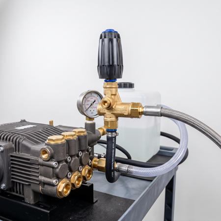 VRT3-250 trapped pressure unloader valve installed on a high-pressure washer pump system.